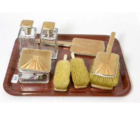 An Art Deco silver and guilloche enamel eight-piece dressing table set, Birmingham, 1937, comprising five various brushes, tw