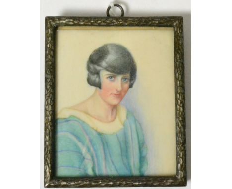 A portrait miniature on ivory titled 'Muriel' painted by Miss I Sutcliffe, label to verso, dated 1924, 8cm high 