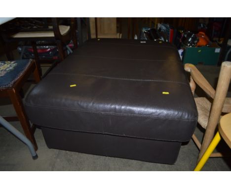 A large leather pouffe