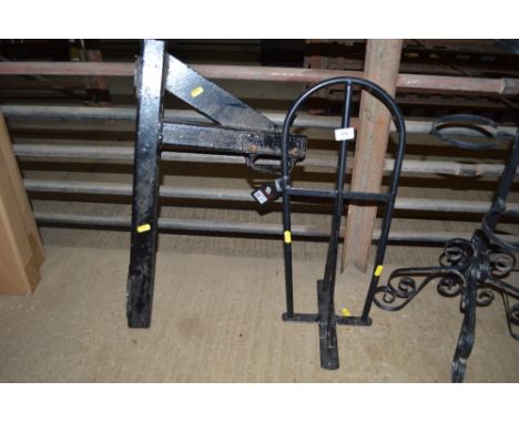 A metal bracket together with a saddle rack