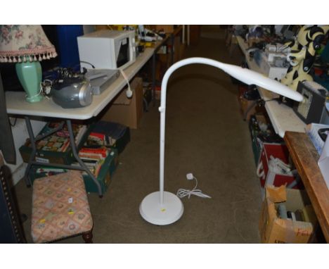 A floor standing reading lamp