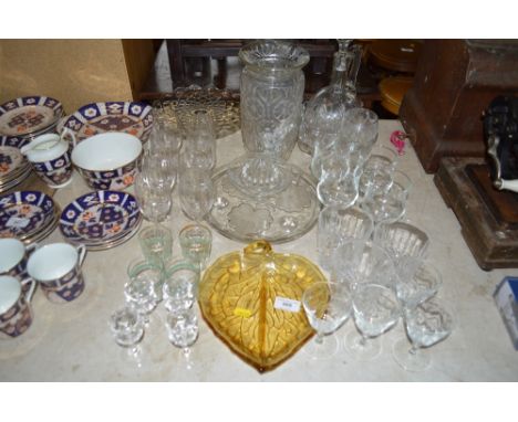 A quantity of glassware to include vases, claret jug, cake stand, drinking glasses etc.