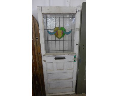 A Victorian pine and stained glass door 