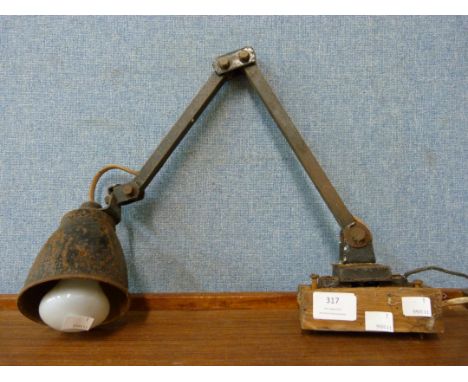 An industrial enamelled articulated lamp 