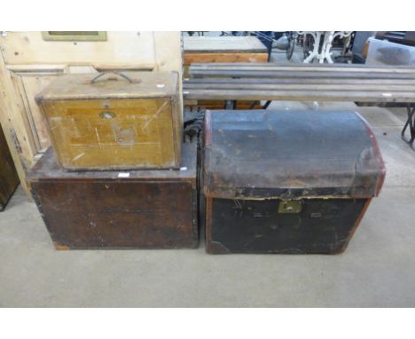 A dome top trunk, a small engineers chest and another 