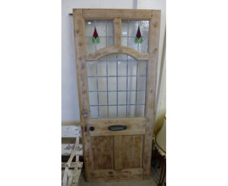 A Victorian pine and stained glass door 