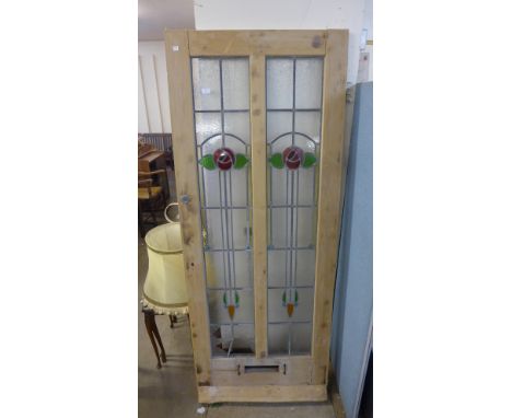 A Victorian pine and stained and glass door 