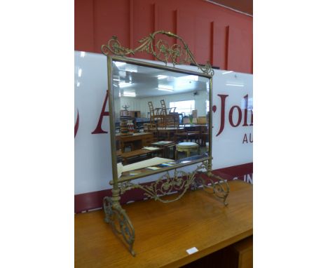 A Victorian Aesthetic movement mirrored brass fire screen 
