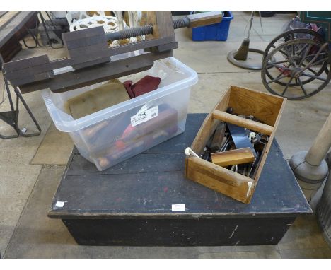 A stained pine carpenter's tool chest with tools 