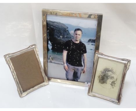 VINTAGE SILVER PHOTOGRAPH FRAME29cm high x 21cm wide, together with a period pair of silver photograph frames 17cm high x 12.