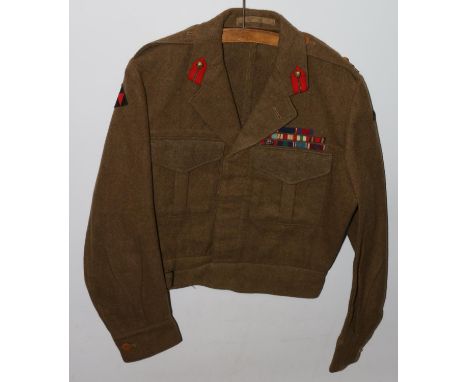 British Army uniform, a British Army khaki green battledress jacket with B Bloom Ltd label "Battledress blouse 1949 pattern" 