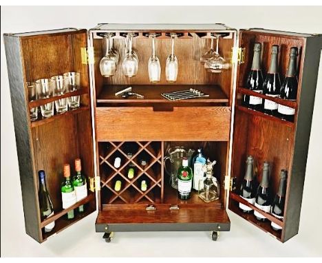 STEAMER TRUNK BAR CABINET, in leather with fitted hardwood interior, 112cm H x 71cm W x 46cm D.