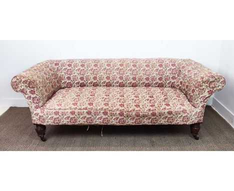 CHESTERFIELD SOFA, Victorian mahogany and gilt heightened with floral patterned upholstery, 67cm H x 200cm x 80cm D.
