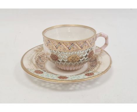 Royal Worcester porcelain reticulated cabinet cup and saucer with gilt landscape and jewelled decoration, honeycomb piercing,