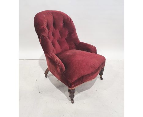 Two Victorian low button-back salon chairs with serpentine front rails, one on turned front legs to white china castors, the 