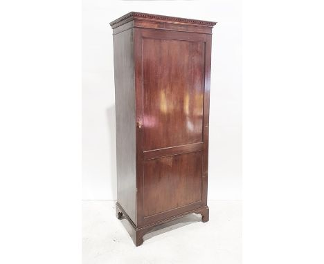 20th century mahogany single door wardrobe, the moulded cornice above single shelf, hanging space under, on bracket feet, 83c