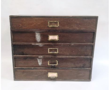 Five-drawer table-top cabinet containing watch springs, parts and clock faces, etc