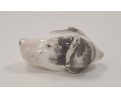 19th century English porcelain miniature dog’s head whistle, enriched in black and brown enamel, 5.5cm long (rubbed and worn)