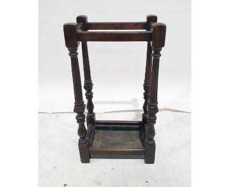 Early 20th century oak umbrella stickstand, the turned and fluted supports to block feet and drip tray, 64cm high 