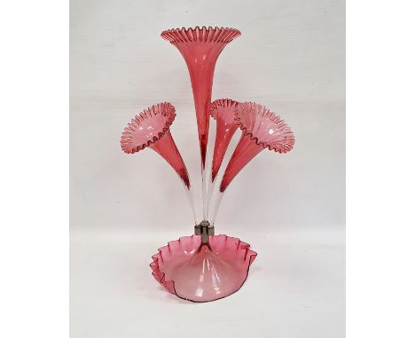 Cranberry and clear glass epergne with central flared trumpet vase, having surround of three smaller, all with frilled rims a