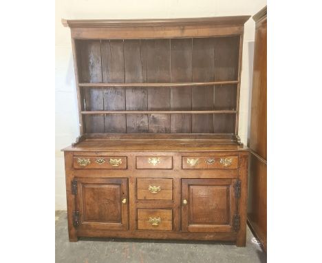 18th century oak dresser, moulded cornice with two shelves, base of five assorted drawers and two cupboard doors, stile suppo