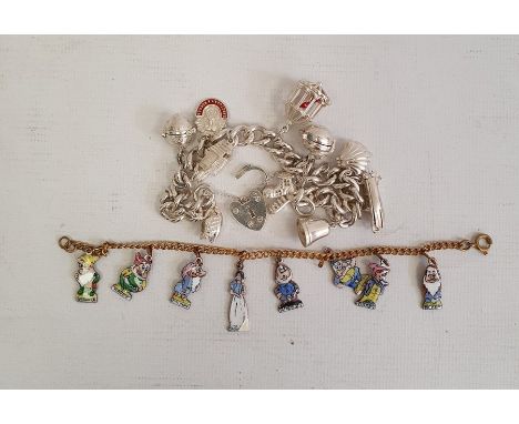 Silver curb link charm bracelet hung with ten assorted charms, some articulated, including a cuckoo clock and with silver hea