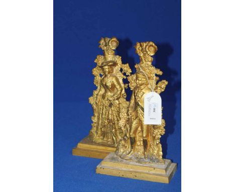 TWO GILT BRONZE FIRE DOGS
in the form of soldiers 