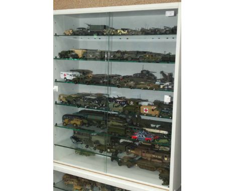 LOT OF MIXED TOY ARMY VEHICLES
in two glazed presentation cabinets