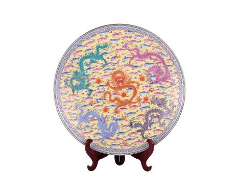 A large Chinese yellow ground Famille Rose porcelain charger with colourful dragons emblematic of the Five Dragon Kings, late