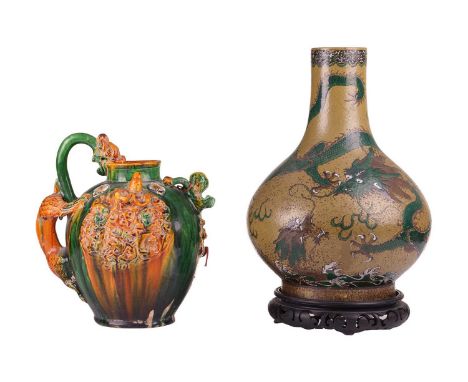A large Chinese bronze green, Famille Rose porcelain bottle vase with a rampaging dragon, bearing an apocryphal Guangxu mark,
