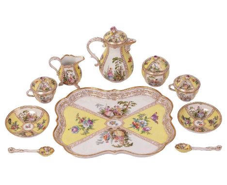 A Continental porcelain cabaret set, 19th century, comprising; a shaped oval tray, a coffee pot and cover, and a cream jug, o