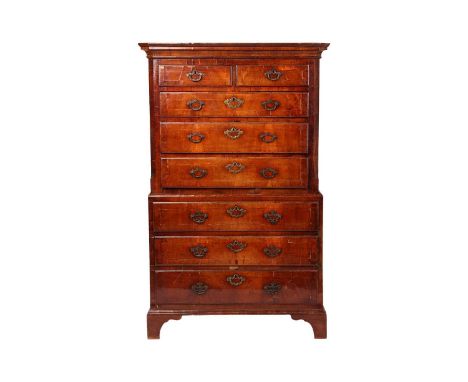A George II walnut and crossbanded chest on chest, front canted corners, brass mounts, two short over six graduated drawers, 