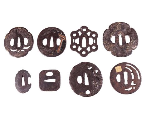 A Japanese iron and mixed metal oval tsuba, Meiji Period, 19th century, decorated with a Torri gate, inlaid flowers and a mou