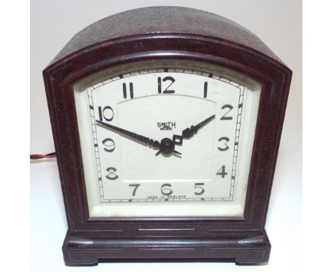 A 1930s Smith Electric mantel alarm clock, Western numerals, arched top square bakelite case. (1 item)