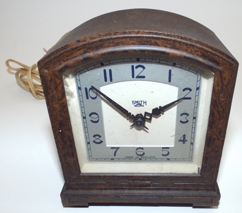 A 1930s Smith Electric mantel alarm clock, Part silvered dial, arched