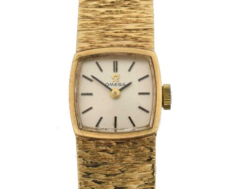 A 1970s 9ct gold Omega manual wind wristwatch, A 1970s 9ct gold Omega manual wind wristwatch, ref. 1061, the signed square di