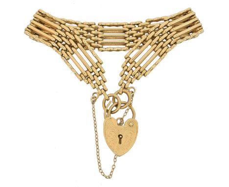 A 9ct gold bracelet, A 9ct gold bracelet, the fancy gate link chain with heart shaped padlock clasp, hallmarks for London, le