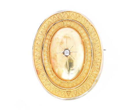 A Victorian diamond brooch, A Victorian diamond brooch, the old cut diamond, star-set into the oval Etruscan surround, with g