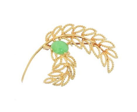 A jade brooch, A jade brooch, the oval jade cabochon atop the openwork foliate spray, stamped 14K, length 5.2cm, gross weight