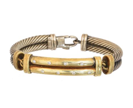 A diamond bangle by David Yurman,  A diamond bangle by David Yurman, the brilliant cut diamond lines inset to the grooved pan