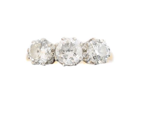 A diamond three stone ring, A diamond three stone ring, the circular cut diamond line with tapered shoulders, estimated total