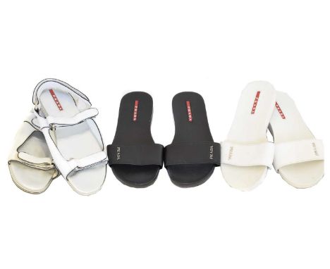 Three pairs of Prada sliders, Three pairs of Prada sliders, to include two white pairs and a black pair, sizes 35 and 36 (UK 