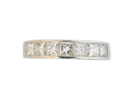 A platinum diamond band ring, A platinum diamond band ring, the princess cut diamond line inset to the polished band, estimat