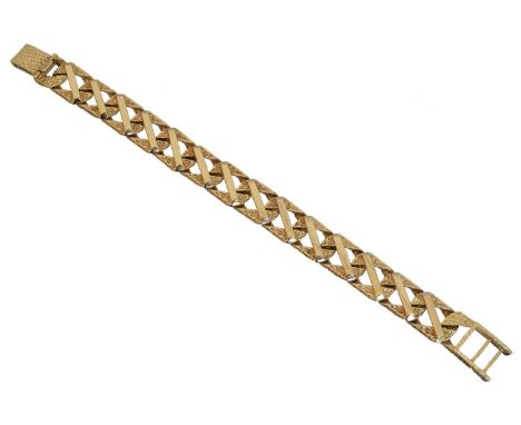 A 9ct gold chain bracelet, A 9ct gold chain bracelet, the textured and polished flat curb link chain with a folding clasp, ha