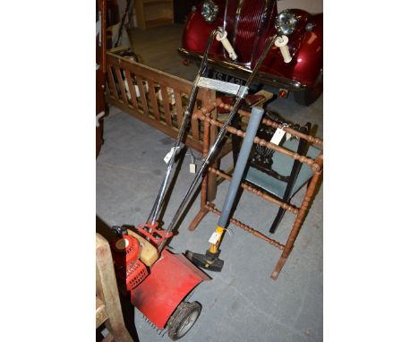 A Mankiss petrol rotavator: together with an maul axe.