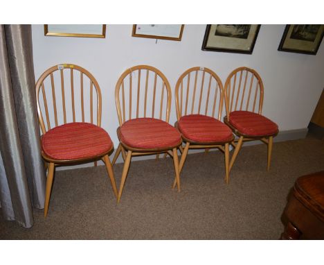 A set of four contemporary Ercol dining chairs.