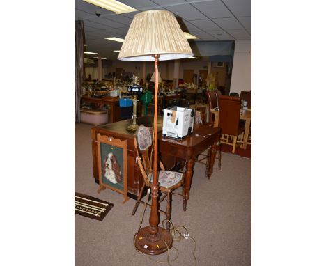 A mahogany standard lamp and shade.