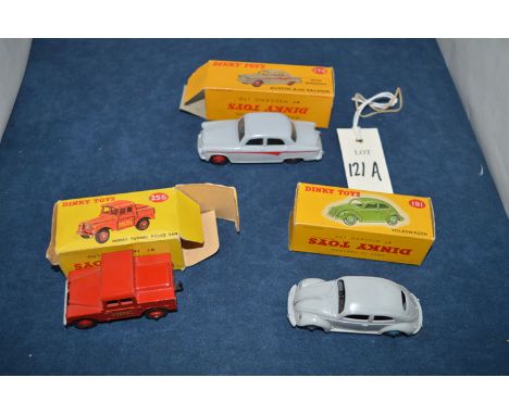 Three boxed Dinky die-cast model vehicles, comprising: model no. 176 Austin A 105 saloon with windows; model no. 181 Volkswag