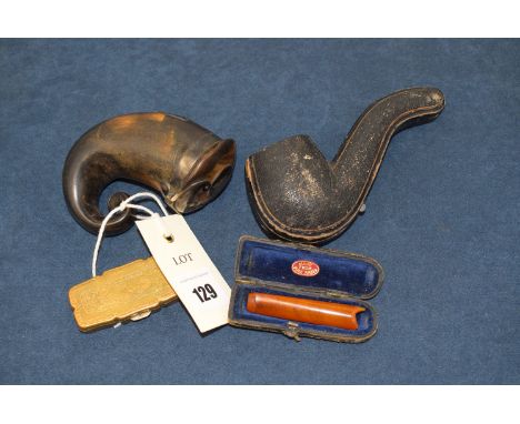 A 19th century horn snuff mull; a cheroot holder; a small brass box and a meerschaum pipe.
