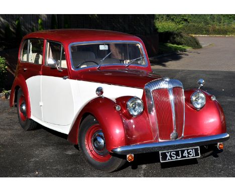 A Daimler DB18, registration XSJ 431, non transferable 2522cc petrol engine, metallic red and cream, mileage under 30,000.THI